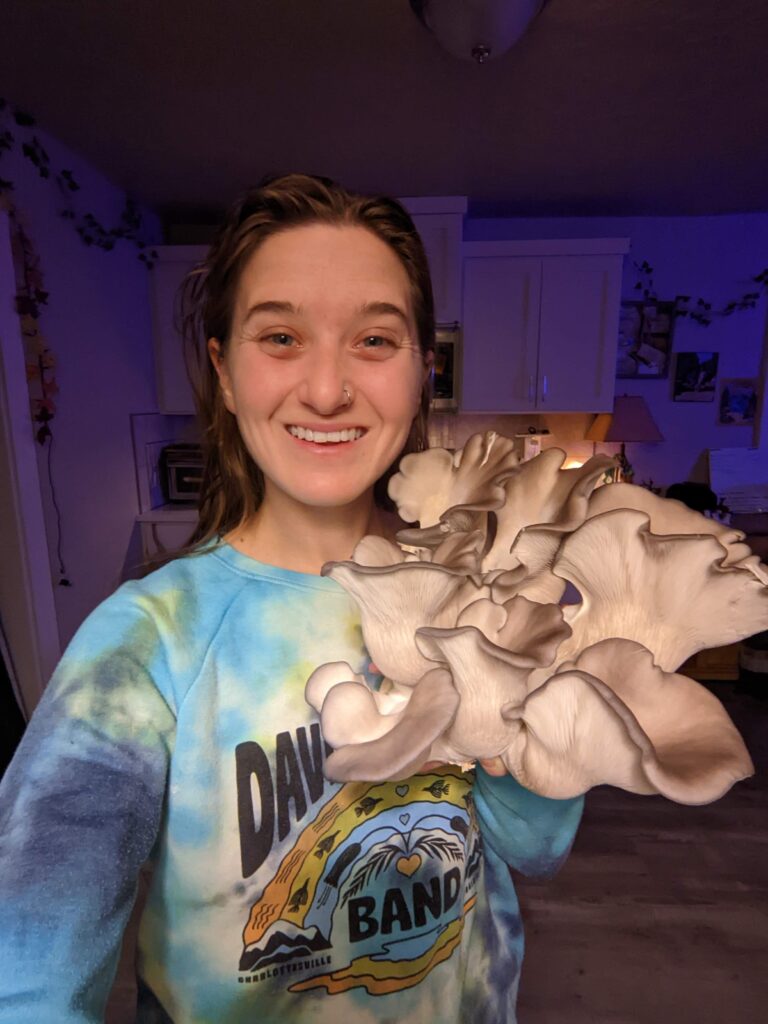 girl posing with mushrooms