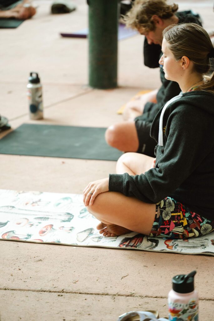 girl meditating on yoga mat